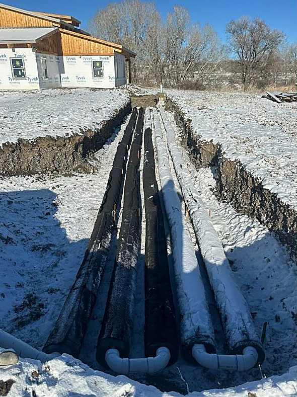 Winter utility trench and pipe install by JH Excavation